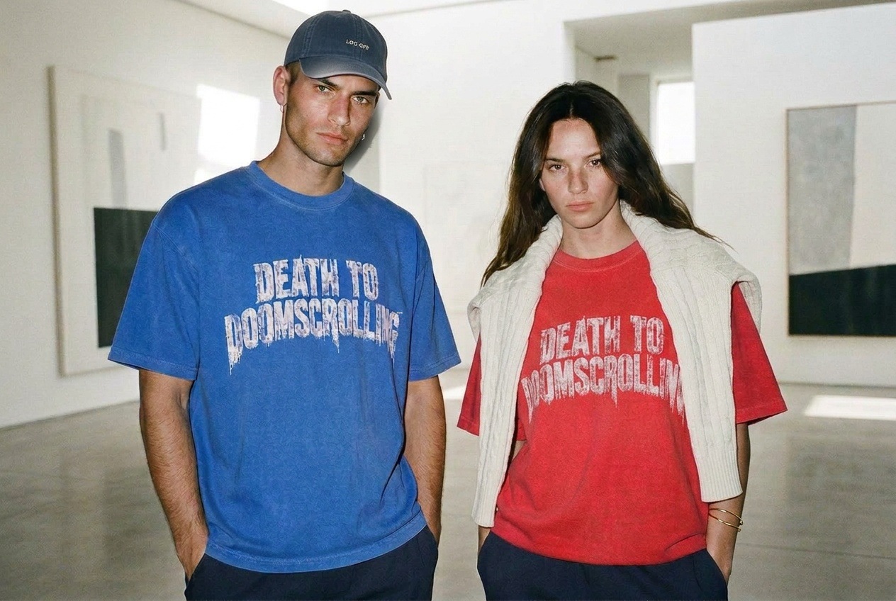 Two models in cobalt and red Death to Doomscrolling tees